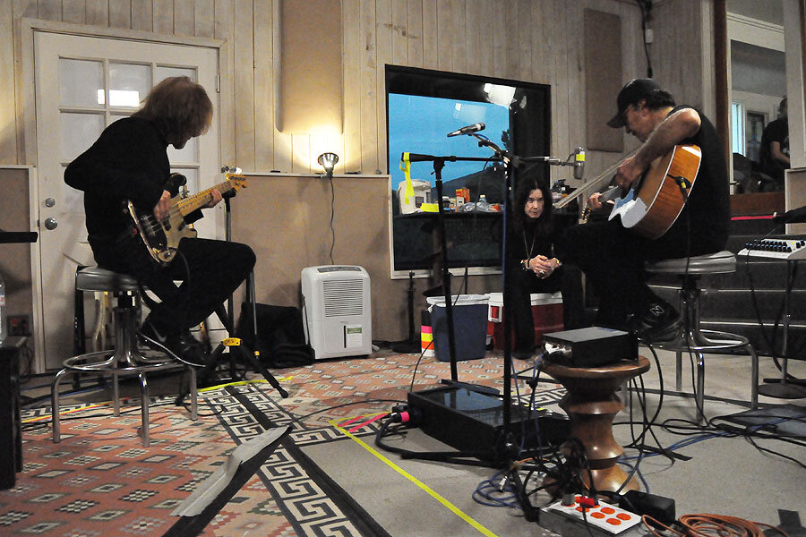 Guitarists tracking in a studio live room